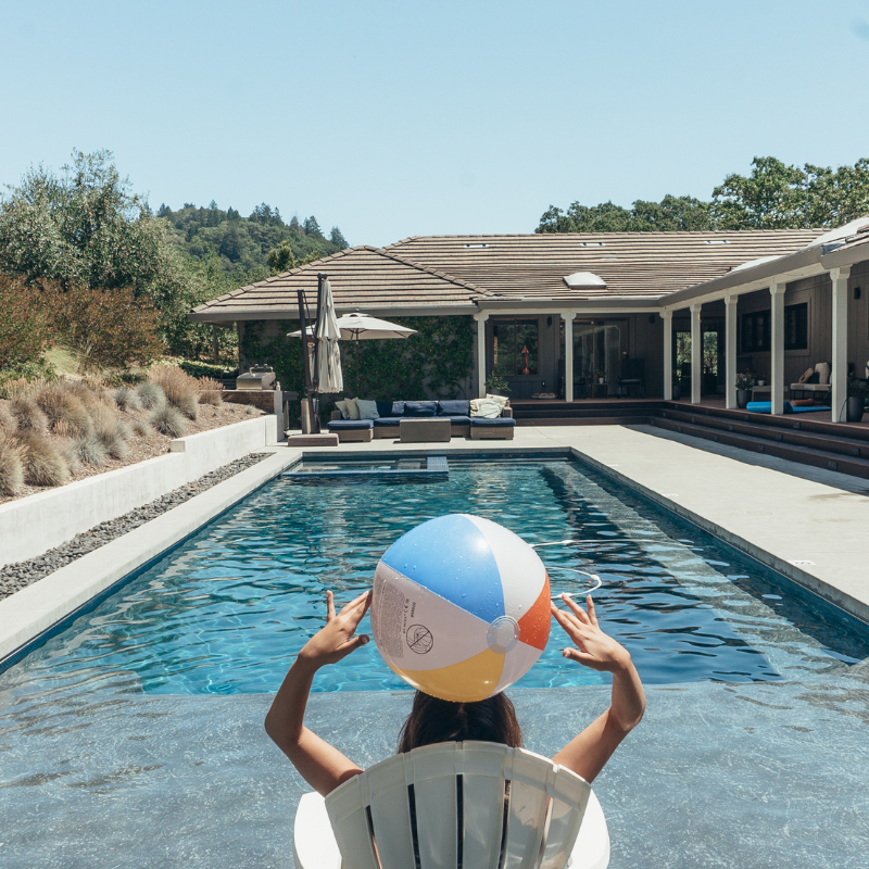 Relaxing by the Pool: Woman Enjoying the Sun in a Luxury Vacation Rental in Napa Valley